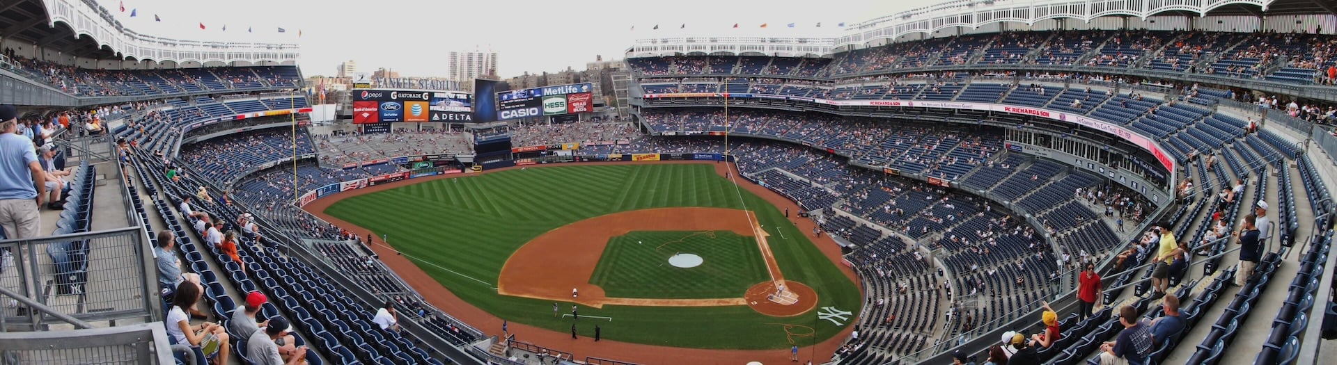 Panoramic view of Yankee Stadium from the upper deck, showing the field, scoreboard, and seating bowl